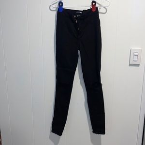 Fashion nova black ripped skinny jeans. Size 7